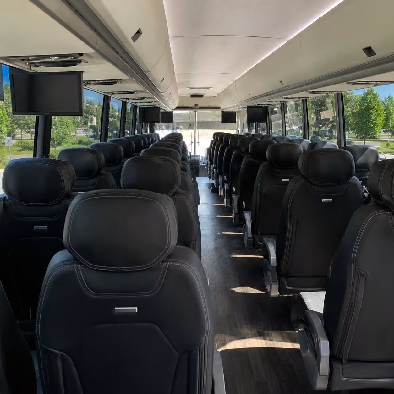 compare charter buses for camden school district and university transportation